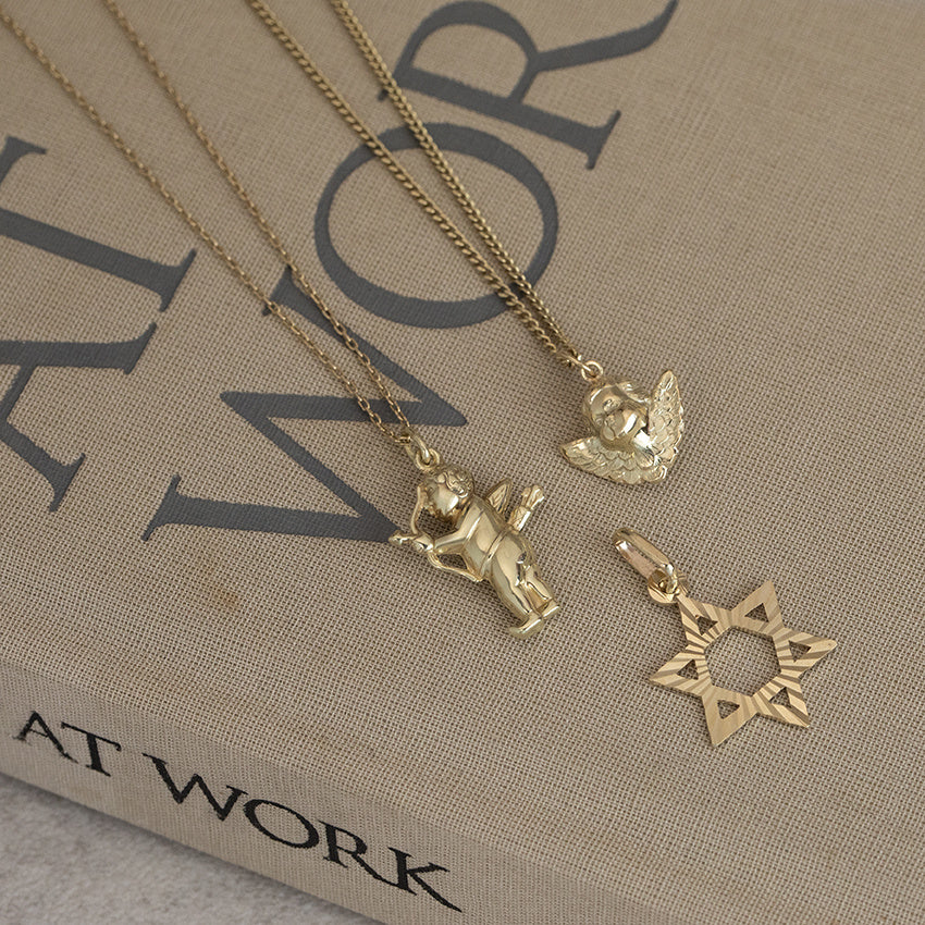 Golden pendant Cupid 14 karat