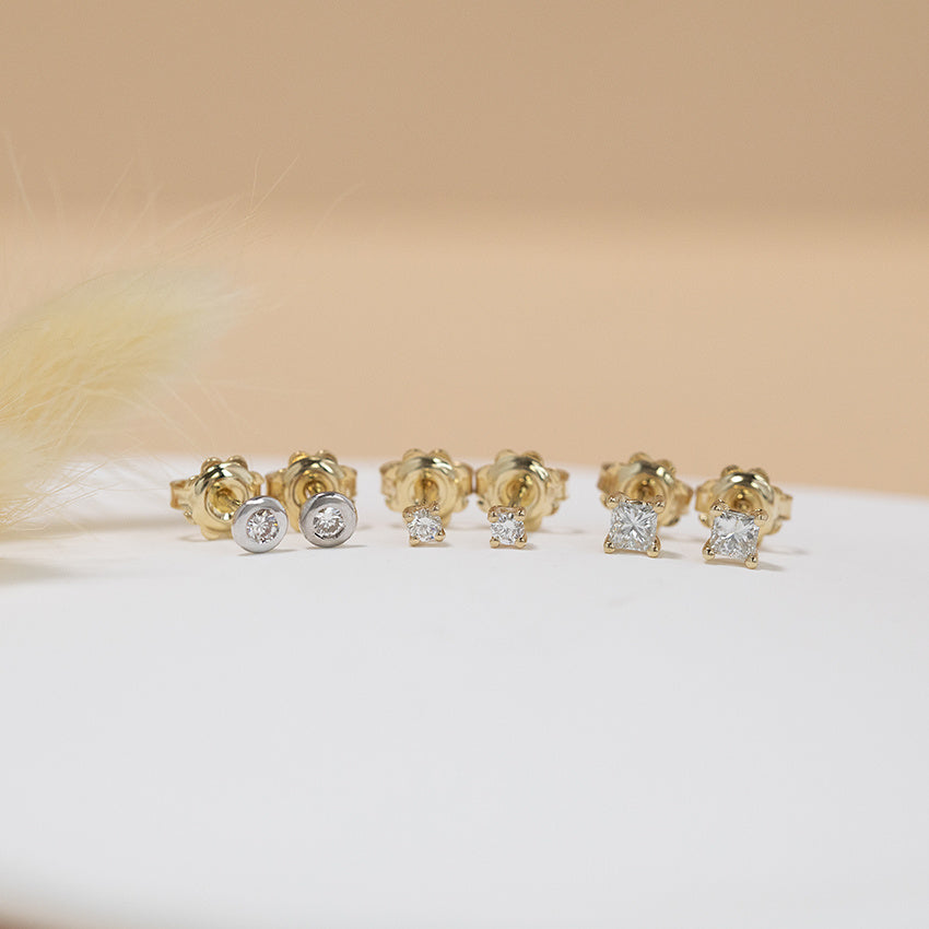 Gold solitaire stud earrings with diamond 14 karat