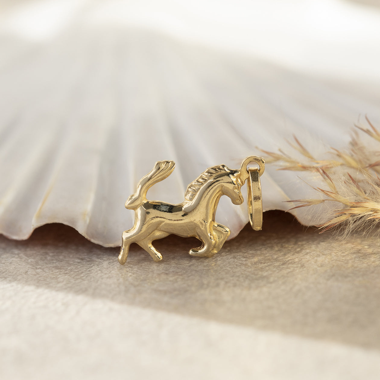 Gouden hanger paard 14 krt