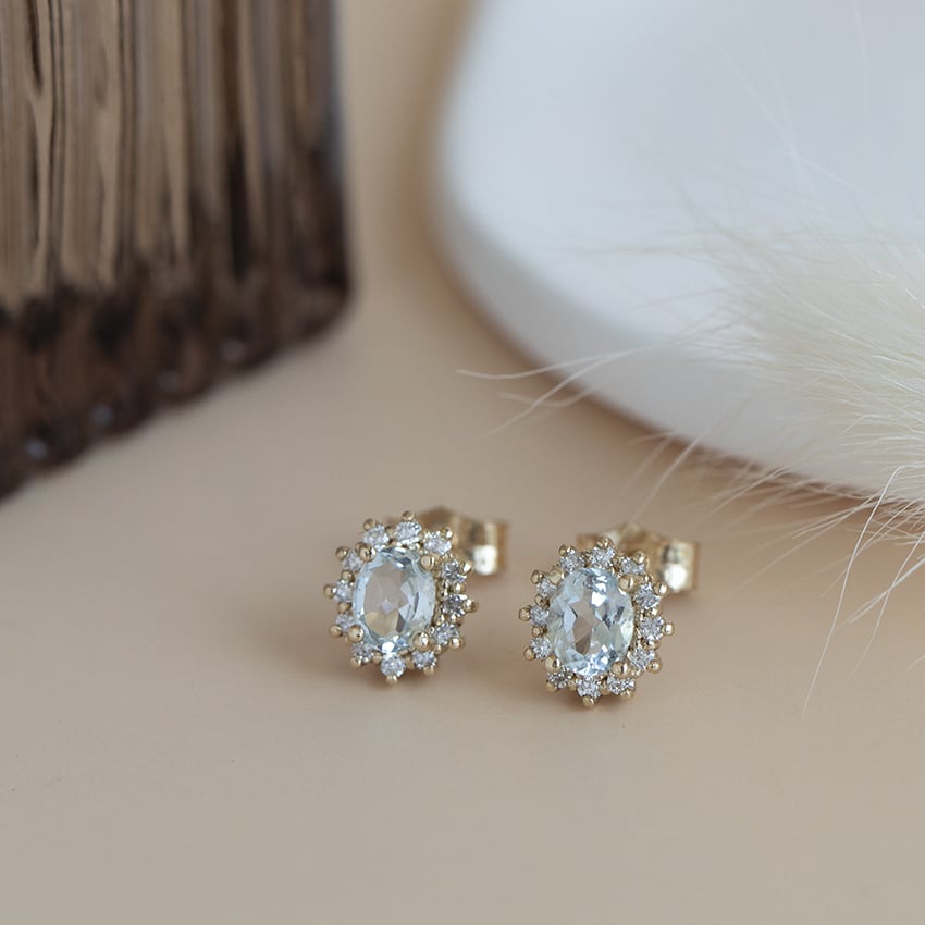 Gouden entourage oorstekers met topaas en diamant 14 karaat* nieuw