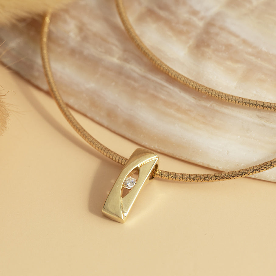 Gold bangle with diamond pendant 14 karat